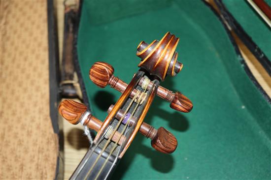 A German Strad style violin and a small violin and two bows